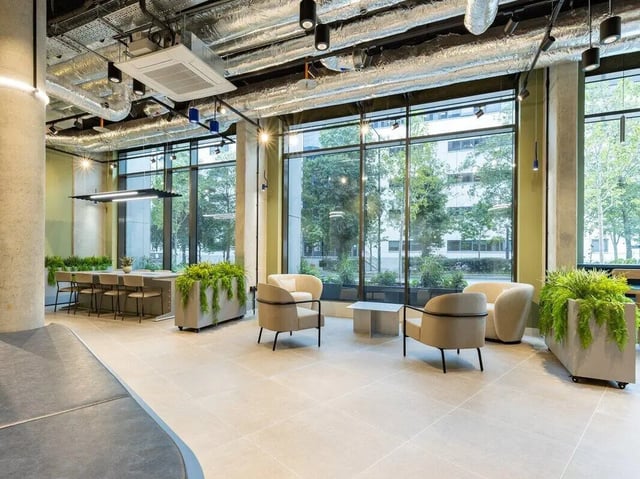 Armchairs coffee table planters lounge area at Sheares Hall in Newcastle Upon Tyne Student Accommodation