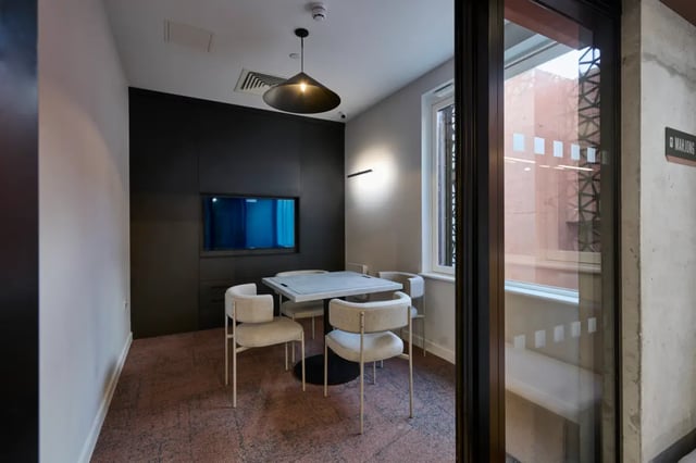 Table chairs television modern communal space at Sheares Hall in Newcastle Upon Tyne Student Accommodation
