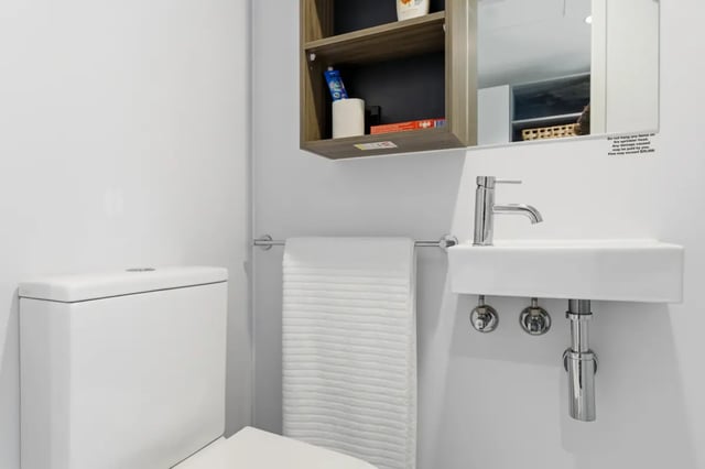 Toilet sink towel rack shelf bathroom at Mayoral Drive Student Accommodation in Auckland Student Accommodation