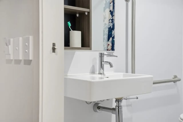 Sink faucet toothbrush holder grab bar bathroom at Mayoral Drive Student Accommodation in Auckland Student Accommodation