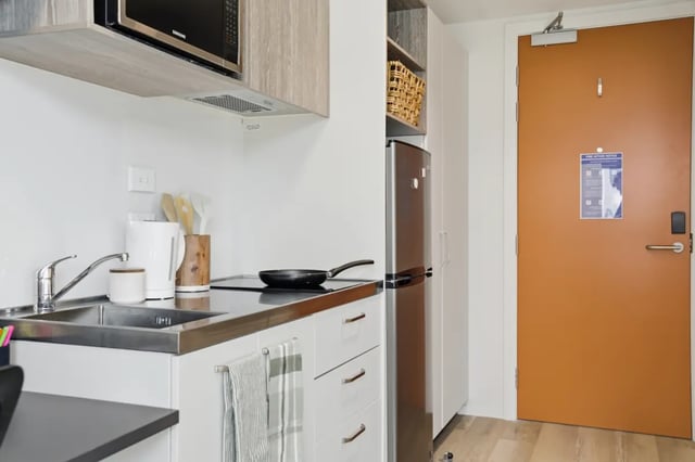 Microwave fridge sink kettle frying pan kitchen at Mayoral Drive Student Accommodation in Auckland Student Accommodation