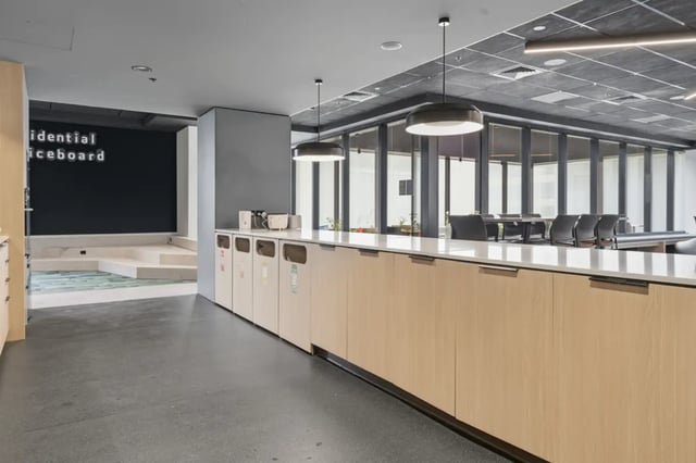Trash bins on counter with meeting room in background. at Mayoral Drive Student Accommodation in Auckland Student Accommodation