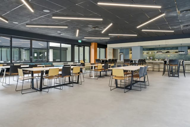 Tables chairs kitchen bar stools common area at Mayoral Drive Student Accommodation in Auckland Student Accommodation