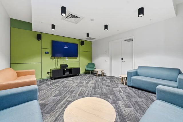 Sofas television and coffee tables common area at Mayoral Drive Student Accommodation in Auckland Student Accommodation