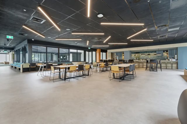 Tables chairs and bar seating common area at Mayoral Drive Student Accommodation in Auckland Student Accommodation