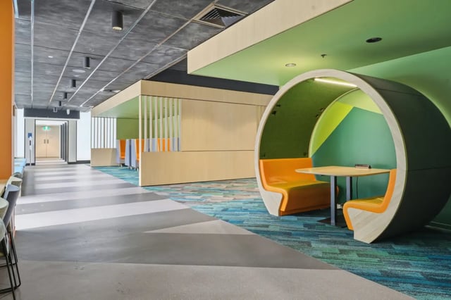 Pod seating with orange benches and table common area at Mayoral Drive Student Accommodation in Auckland Student Accommodation
