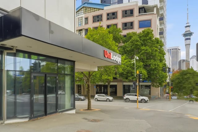 Modern UniLodge building entrance with city skyline exterior at Mayoral Drive Student Accommodation in Auckland Student Accommodation