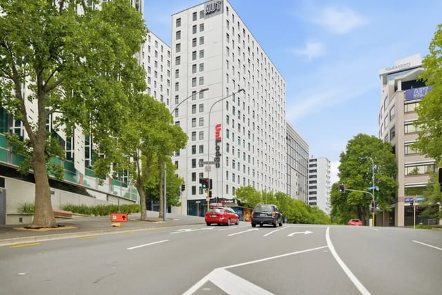 AUT Uni Lodge buildings with cars on road exterior at Mayoral Drive Student Accommodation in Auckland Student Accommodation
