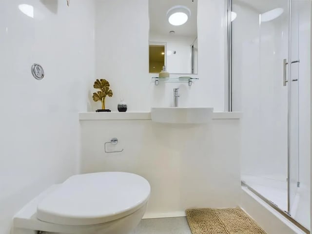 Toilet sink shower and mat bathroom at Sheares Hall in Newcastle Upon Tyne Student Accommodation