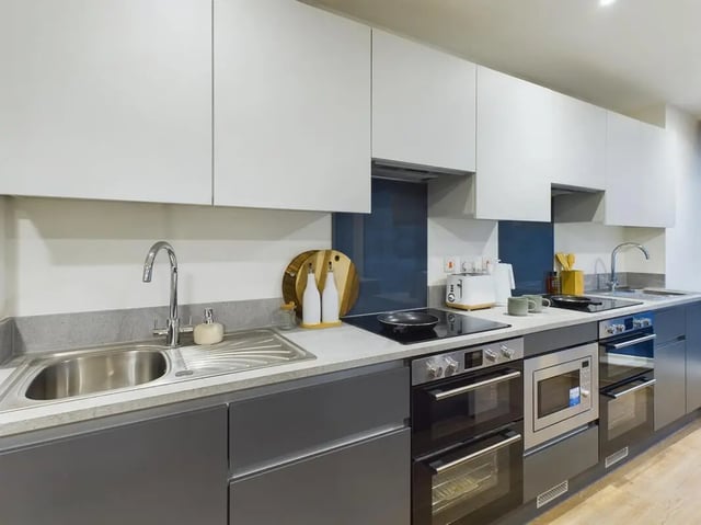 Modern kitchen with sink ovens and cabinets kitchen at Sheares Hall in Newcastle Upon Tyne Student Accommodation