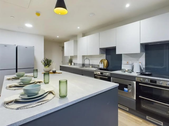 Modern kitchen with island fridge and appliances kitchen at Sheares Hall in Newcastle Upon Tyne Student Accommodation