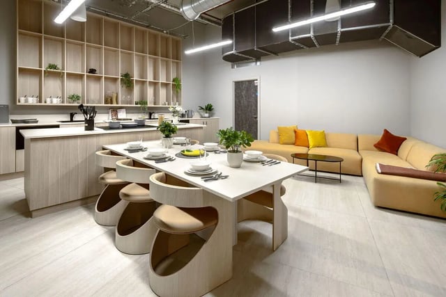 Dining table with chairs kitchen and sofa Living room at True Nottingham in Nottingham Student Accommodation