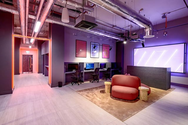 Computers chairs desk red sofa gaming area at True Nottingham in Nottingham Student Accommodation