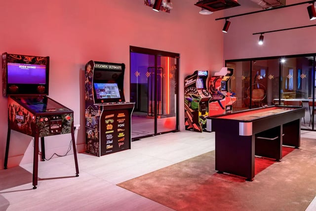 Arcade games and shuffleboard table recreation area at True Nottingham in Nottingham Student Accommodation
