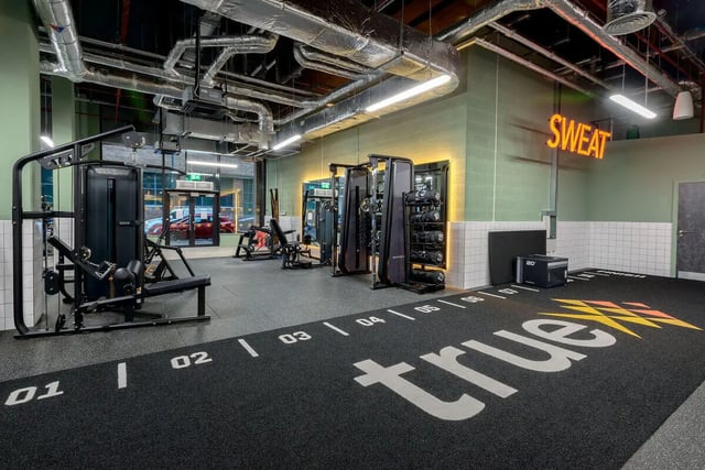 Gym equipment with weights and sweat sign Gym at True Nottingham in Nottingham Student Accommodation