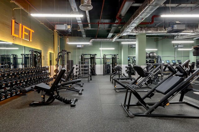 Dumbbells weight machines gym equipment playing area gym at True Nottingham in Nottingham Student Accommodation