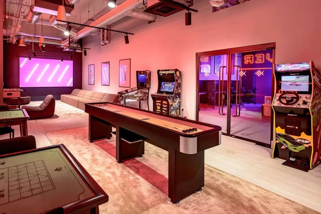 Shuffleboard arcade games couch and foosball table recreation room at True Nottingham in Nottingham Student Accommodation