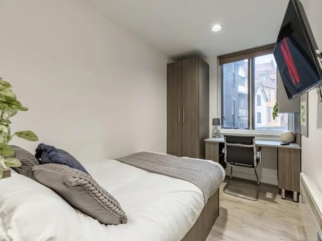 Bed wardrobe desk chair study bedroom at Centre Gate in Bristol Student Accommodation