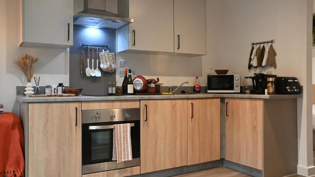 Modern student kitchen with oven microwave and toaster kitchen at Hill View Place in Exeter Student Accommodation