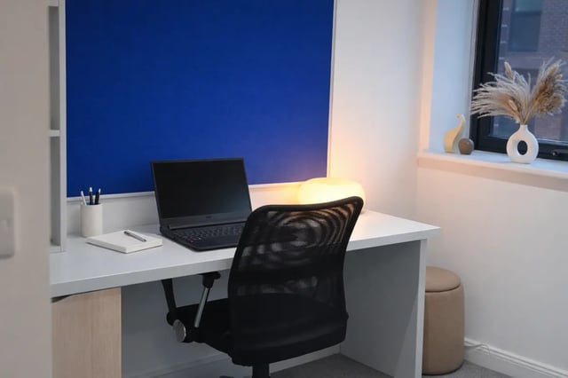 Laptop desk chair lamp blue board study area at Hill View Place in Exeter Student Accommodation