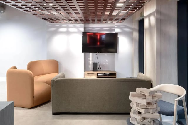 Sofa chairs television Jenga living room at True Sheffield in Sheffield Student Accommodation
