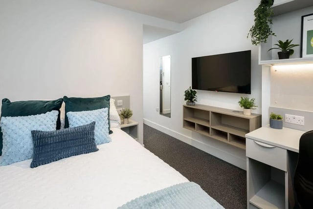 Bed with pillows desk and TV bedroom at True Sheffield in Sheffield Student Accommodation