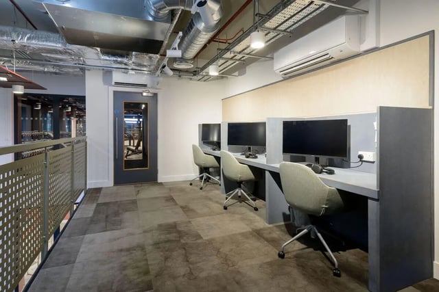 Computers and chairs in a study area at True Sheffield in Sheffield Student Accommodation
