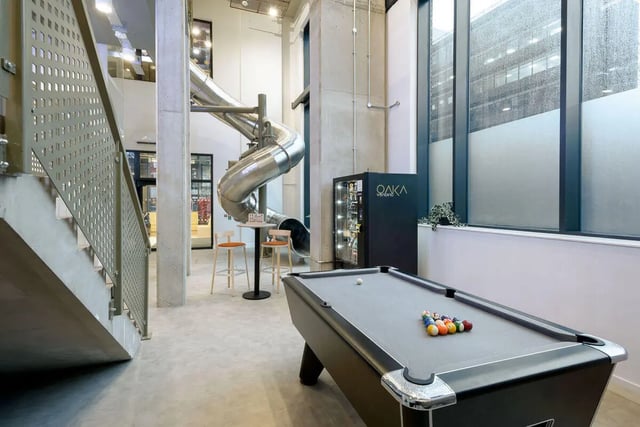 Pool table vending machine slide stairs communal area at True Sheffield in Sheffield Student Accommodation