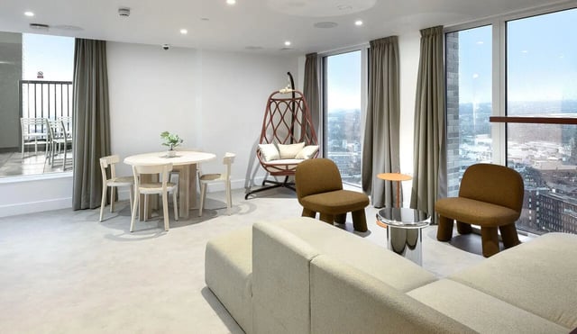 Dining table chairs swing chair sofa living room at True Sheffield in Sheffield Student Accommodation