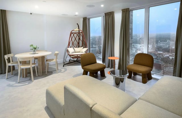 Dining table chairs swing chair sofa living room at True Sheffield in Sheffield Student Accommodation