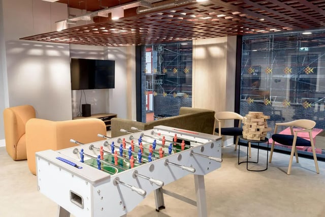 Foosball table chairs couches television living room at True Sheffield in Sheffield Student Accommodation