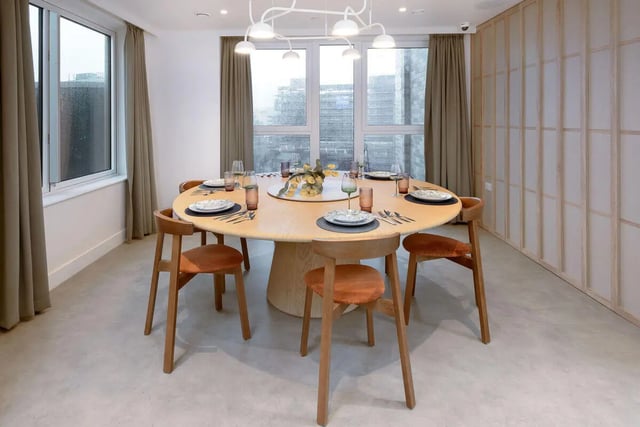 Round table with place settings and chairs dining area at True Sheffield in Sheffield Student Accommodation