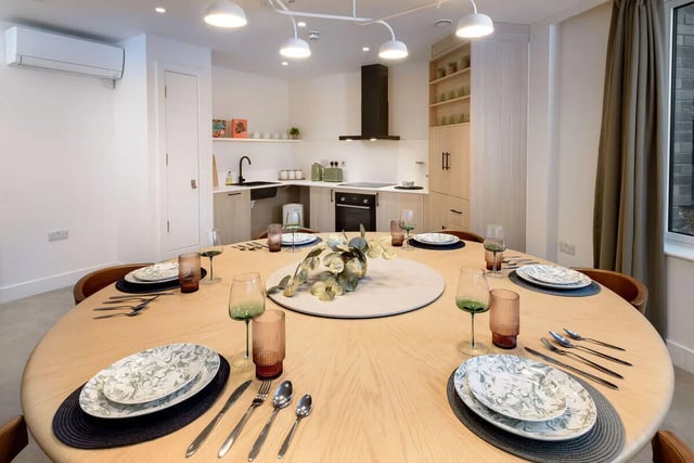 Dining table set with plates and glasses kitchen dining room at True Sheffield in Sheffield Student Accommodation