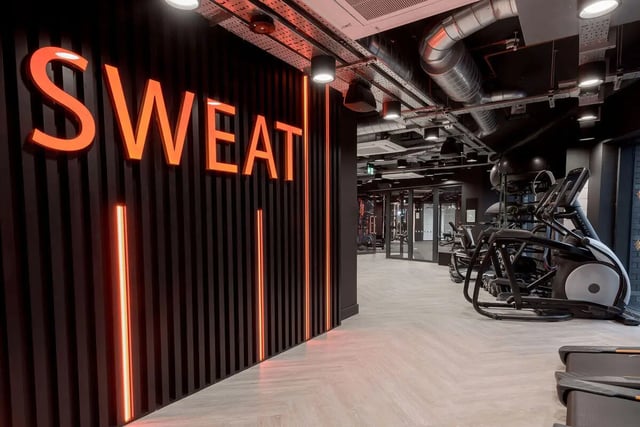 SWEAT sign treadmill elliptical gym fitness area at True Sheffield in Sheffield Student Accommodation