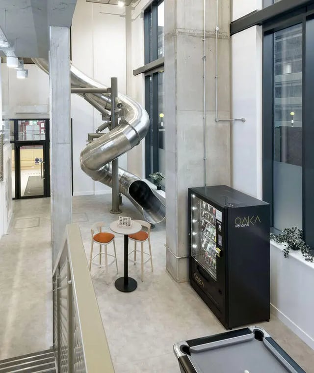 Silver slide vending machine and pool table lounge area at True Sheffield in Sheffield Student Accommodation