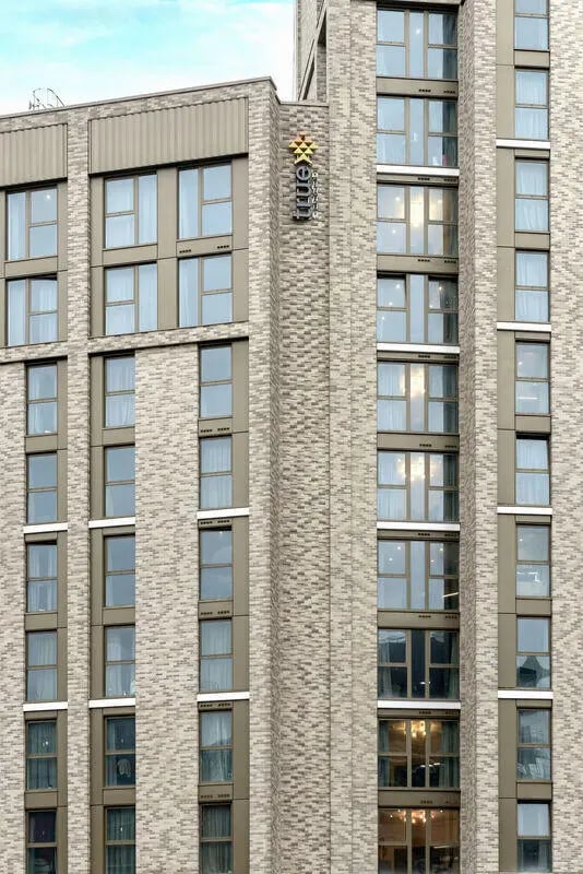 Brick building with many windows exterior at True Sheffield in Sheffield Student Accommodation