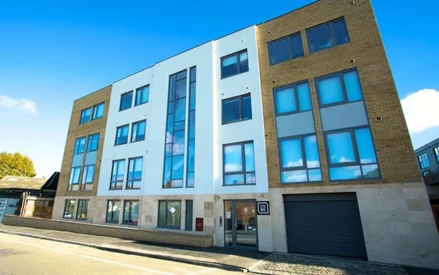 Modern apartment building with large windows exterior at The Cube Greenwich in London Student Accommodation
