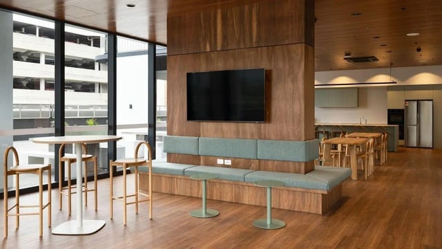 Bench with television and kitchen area living room at UniLodge Perth Central in Perth Student Accommodation