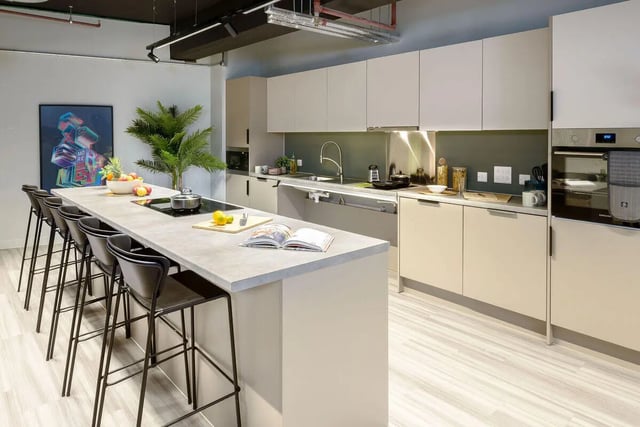 Modern kitchen with island, stools, and appliances Kitchen at True Leicester in Leicester Student Accommodation