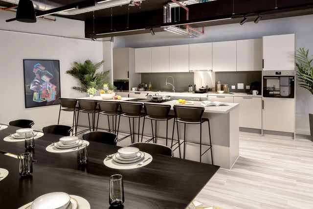 Modern kitchen with island dining area and bar stools kitchen at True Leicester in Leicester Student Accommodation
