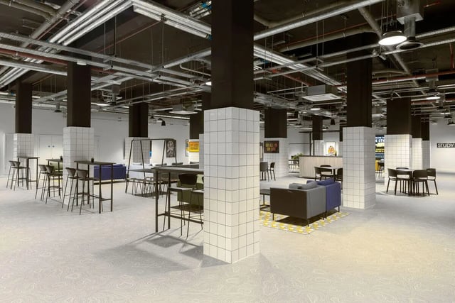 Student common area with tables sofas and chairs. at True Leicester in Leicester Student Accommodation