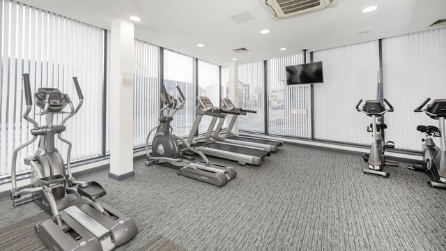 Elliptical treadmills stationary bikes exercise room at Glassworks - Liverpool in Liverpool Student Accommodation