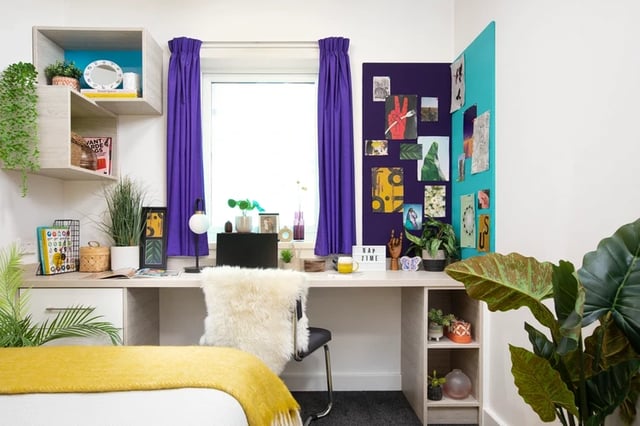 Desk with chair plants and bed study area at The Bakery in Cardiff Student Accommodation