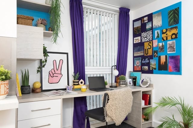 Desk with laptop plants and photos Study area at The Bakery in Cardiff Student Accommodation