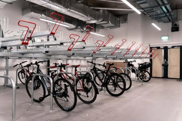 Rows of bicycles parked in a secure storage area Bicycle storage exterior at LIV Student Belfast in Belfast Student Accommodation