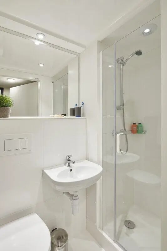 Modern white shower sink and toilet bathroom at LIV Student Sheffield in Sheffield Student Accommodation
