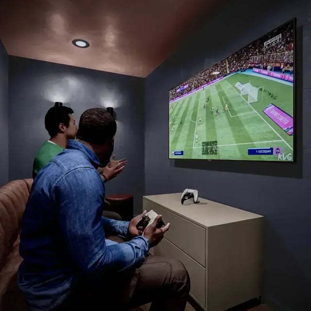 Two students playing video game on couch playing area at Hawthorne House in London Student Accommodation