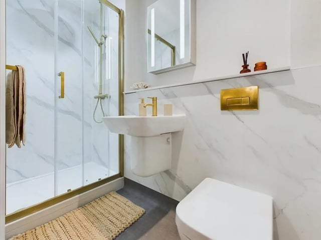 Modern bathroom with shower sink and toilet. at 26 Great George Street in Leeds Student Accommodation