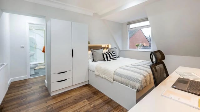Bed wardrobe and bathroom student bedroom at 26 Great George Street in Leeds Student Accommodation