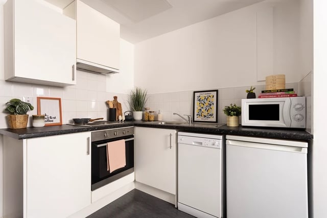 Compact kitchen with oven microwave and dishwasher kitchen at Shrubhill House in Edinburgh Student Accommodation